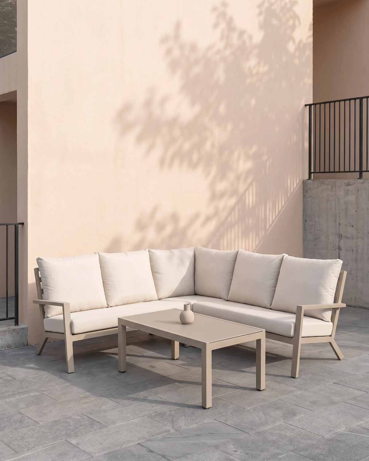 Tierra Outdoor Azzurro corner set on a courtyard terrace